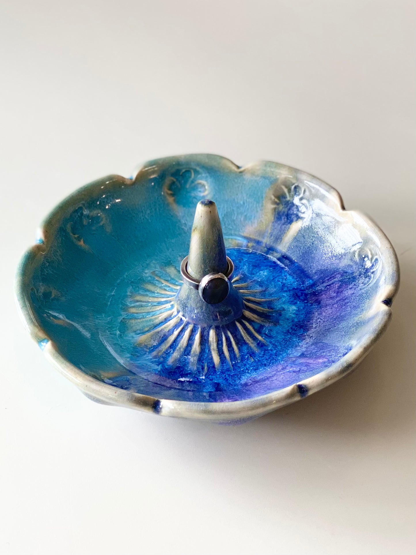 Ring Dish with a glossy purple and blue glaze and smooth center ring stem