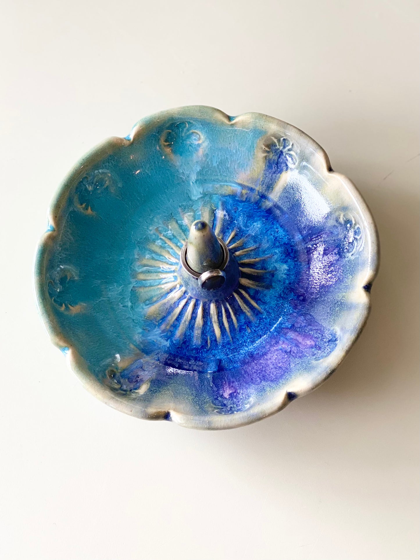 Ring Dish with a glossy purple and blue glaze and smooth center ring stem