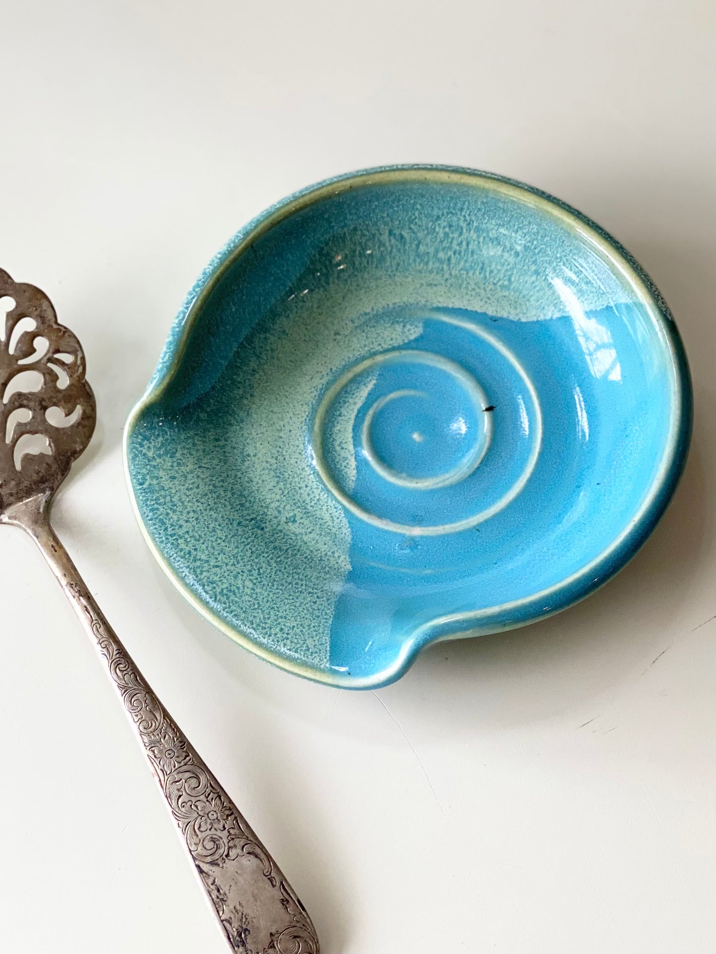 Spoon Rest with a glossy blue and green glaze, 5.25”